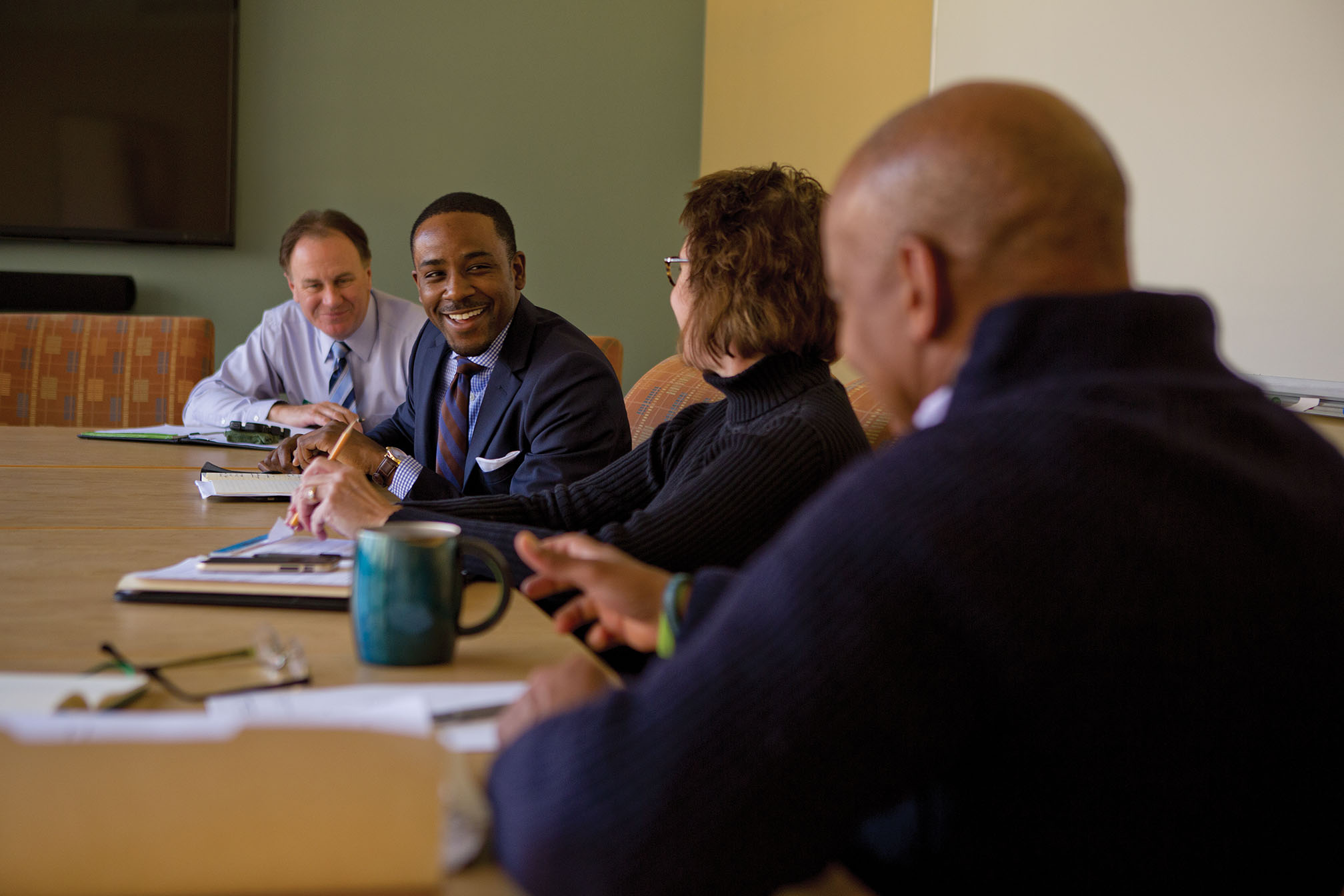 Range, who admits he was “not focused at all” during his high school and early college years, has clearly changed course. In addition to his studies at Michigan State, he works as a graduate assistant in the athletics department and in Residential and Hospitality Services (RHS). Here, he attends a meeting of the RHS Executive Leadership Team.