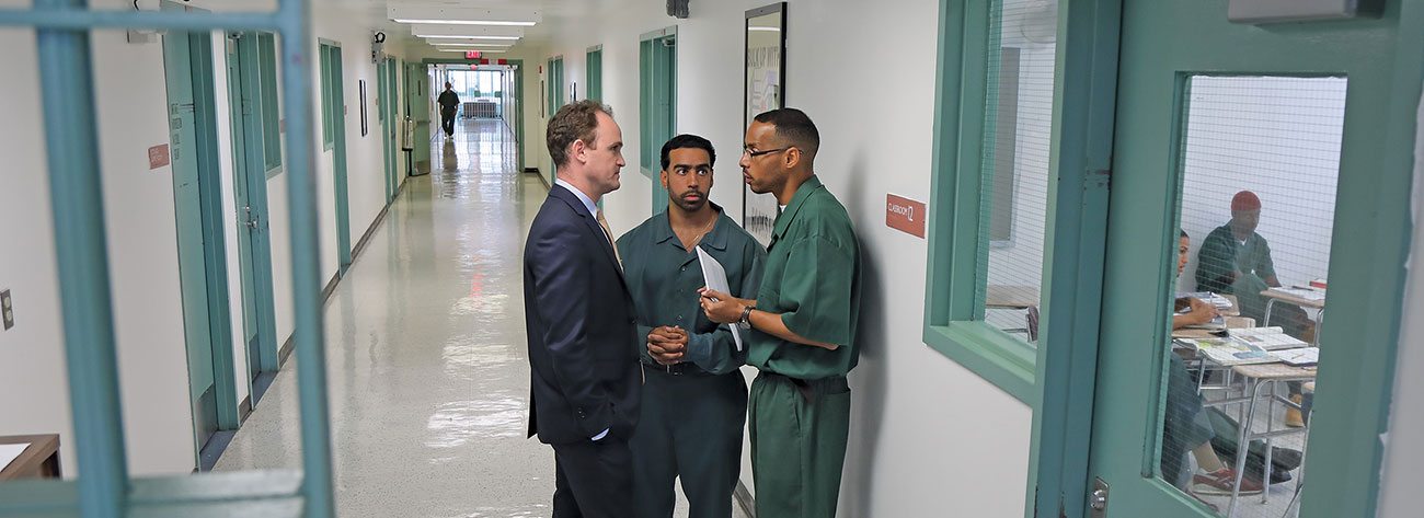 Outside a classroom in the Eastern Correctional Facility in Napanoch, N.Y., Bard Prison Initiative founder and Executive Director Max Kenner confers with incarcerated students Carlos Polanco (center) and Elias Beltran.