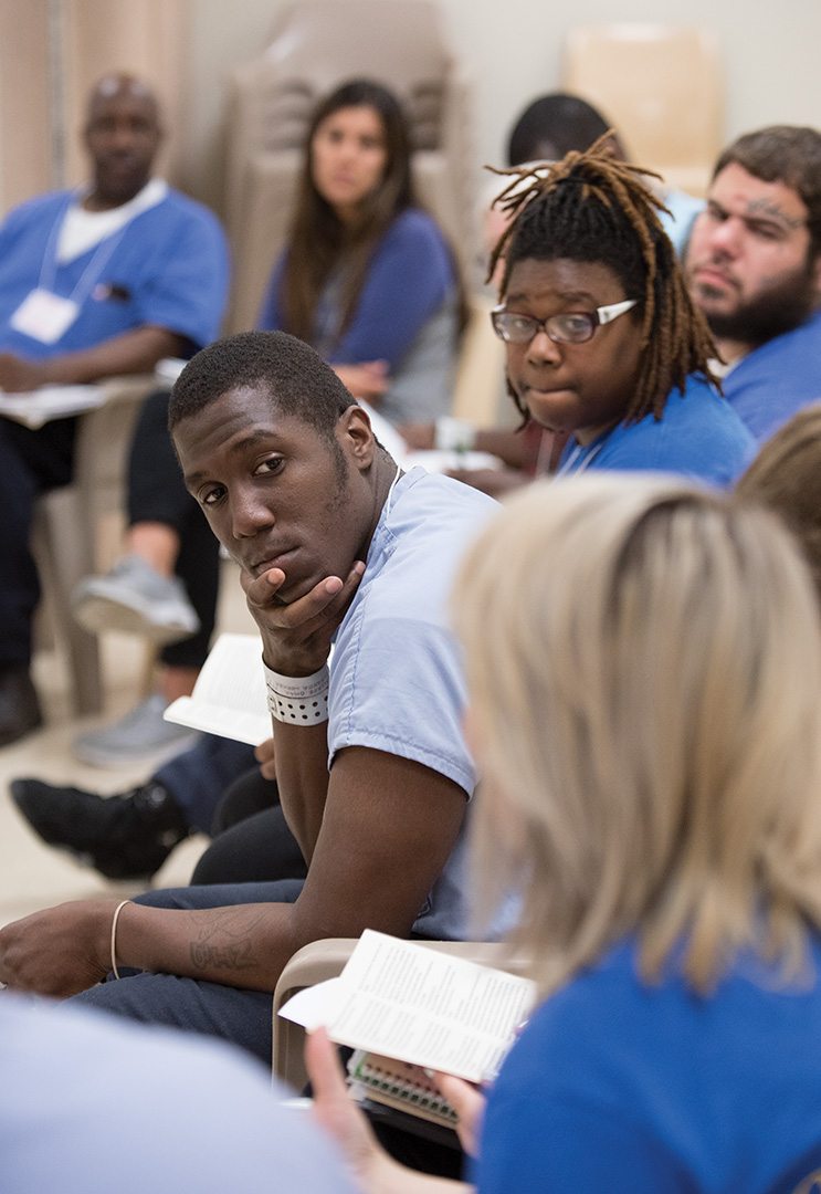 During Inside-Out classes, incarcerated students and those who visit from the “outside” purposefully sit side by side to encourage productive interaction. Here, inmate Omar sits to the left of Yaa, a senior at St. Joseph’s University. (To comply with corrections department policy, all participants are identified by first name only.)