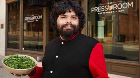 Daniel Castellanos shows off his signature salad outside The Pressroom restaurant in Lancaster, Pennsylvania.