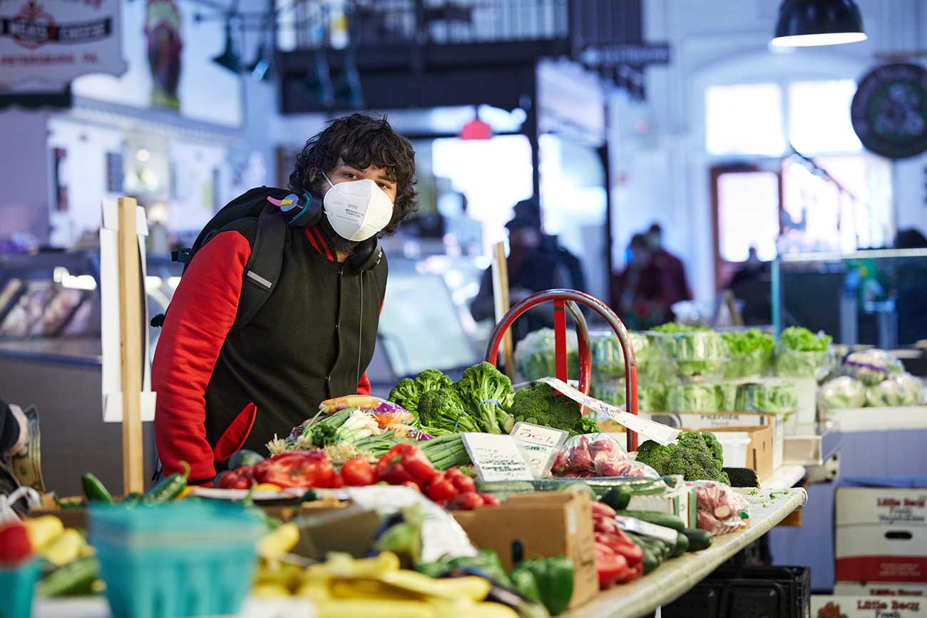 Daniel Castellanos shoping for fresh produce at Lancaster’s Central Market.