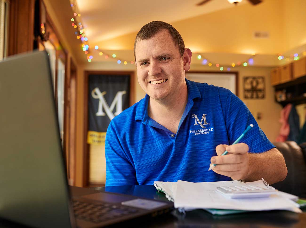 Integrated Studies student Eric Raymond, here attending a videoconference class during the campus closure.