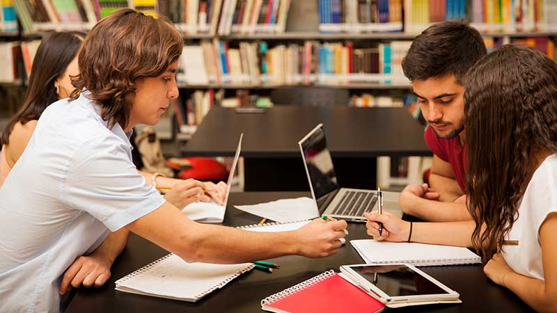 Stock photo: students 'round the table.