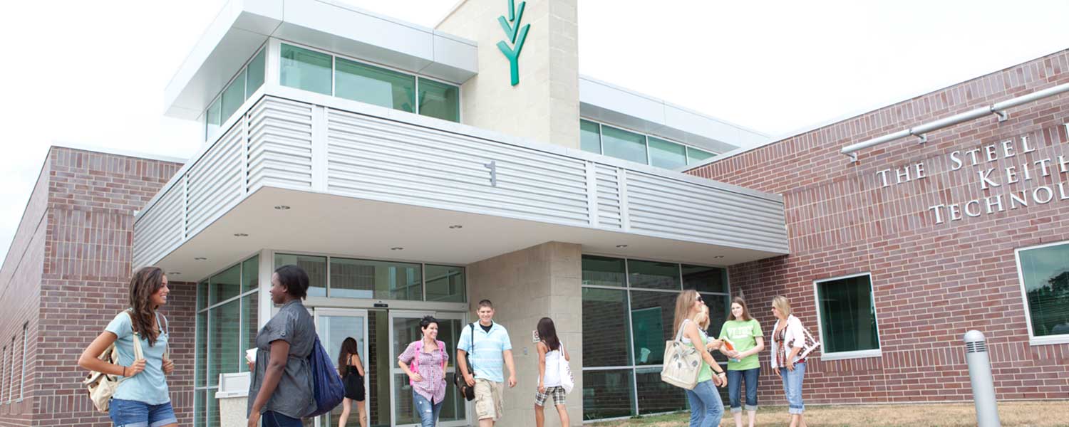 Students talking outside IvyTech campus building.