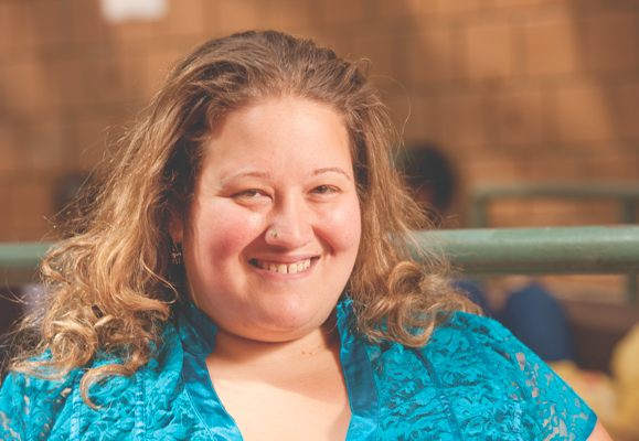 Smiling photo of Marisa Klages, an associate professor of English and the director of assessment at LaGuardia Community College.