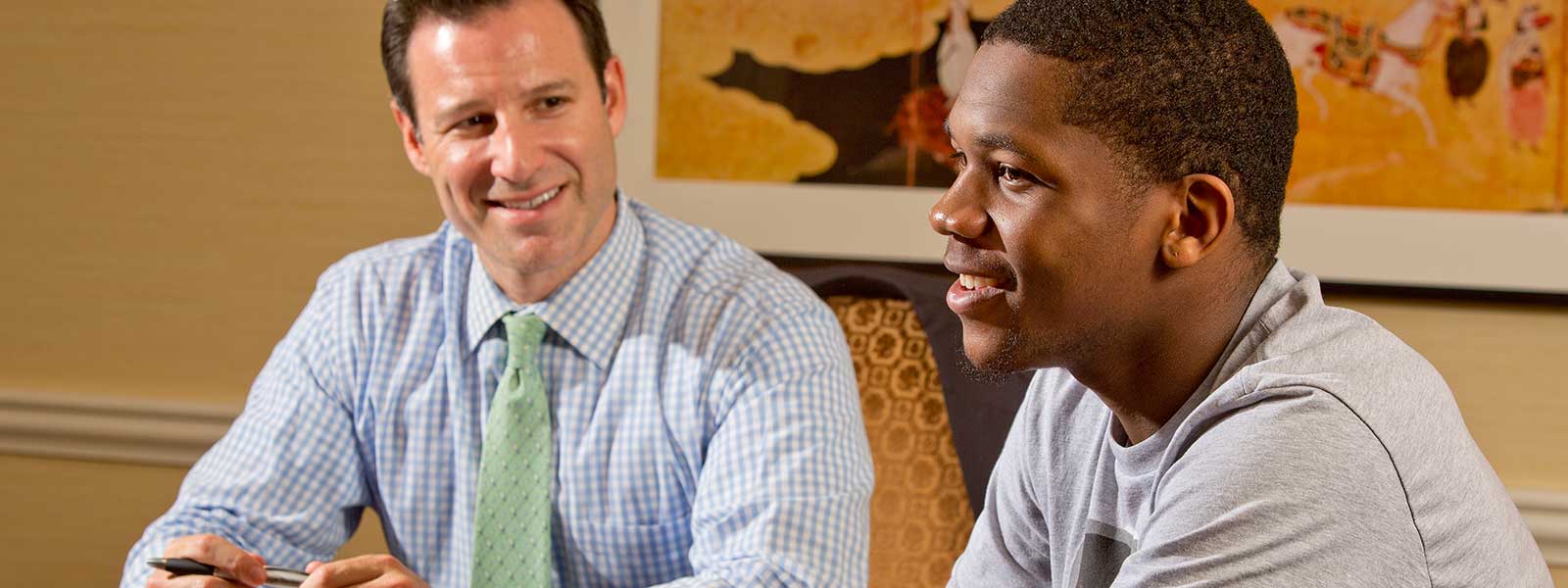 Adam Jacobs, a financial adviser with Morgan Stanley in New York City, has gained a lot from acting as a mentor to Kevin Wade (right). In fact, he calls it, “hands down, one of the best experiences I’ve been involved with. ... He’s like the little brother who actually listens to me.”