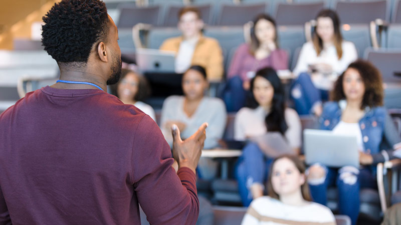 Students with instructor in an alternative classroom setting.