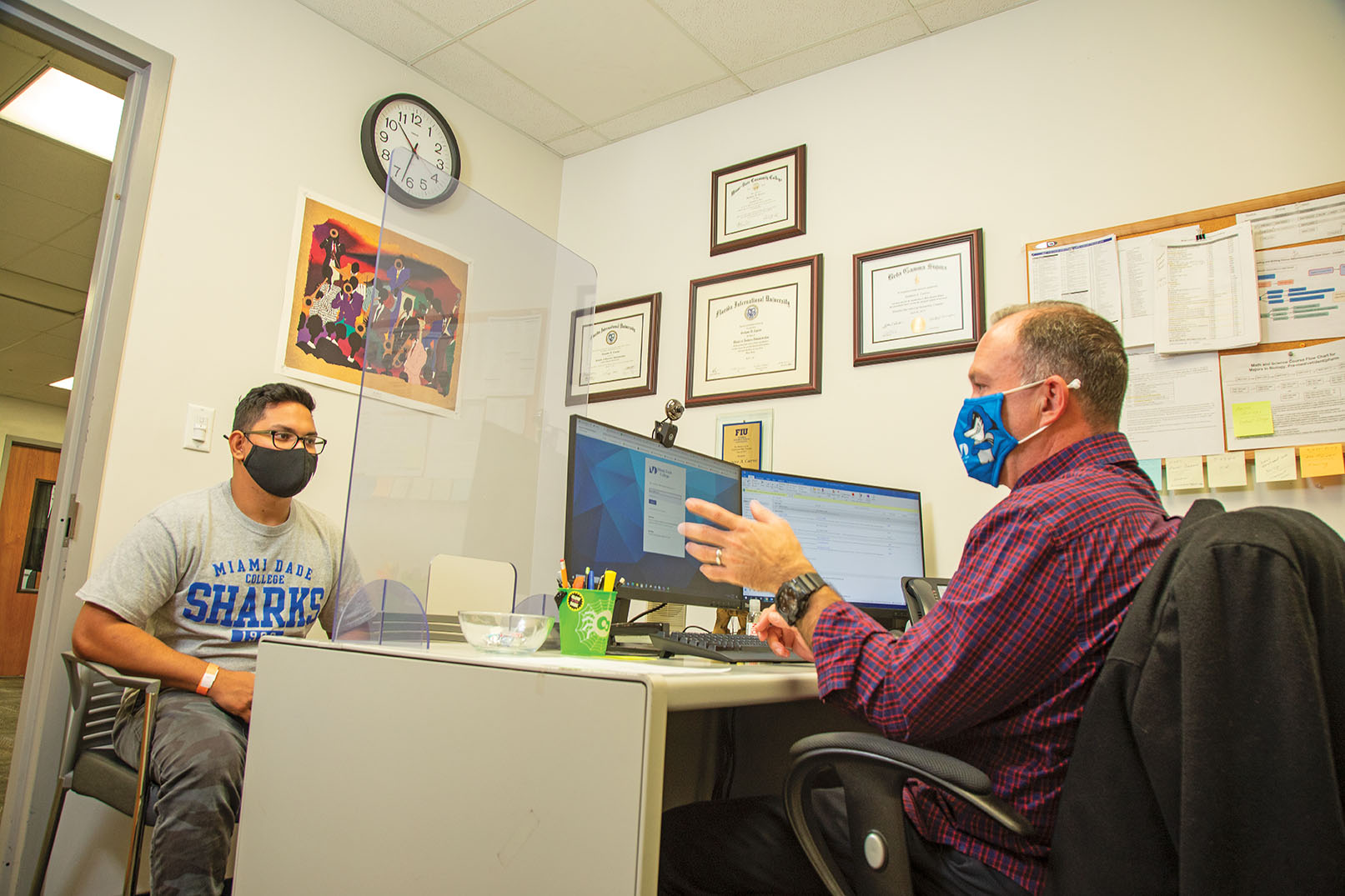 Miami Dade student Martin Rivera (left), who’s studying to be an emergency medical technician, works with his advisor, Gustavo Cuervo, on the college’s Homestead campus.