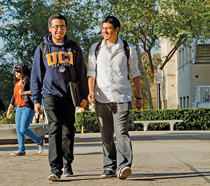 Juan Carlos Alcocer (left) and Rodrigo Marcos Ramirez are now students at UC-Irvine, but neither of them could see a clear path to college during their younger years. The Santa Ana Partnership helped clear the path for both. “Nobody in my family ever graduated from high school,” Alcocer says, “but I jumped through all these obstacles, and here I am.”