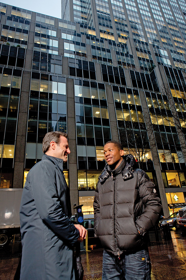 The mentoring relationship between Adam Jacobs (left) and Kevin Wade has had positive effects on both lives. Wade is now a successful college student, and Jacobs has redirected his career in finance so he can serve clients more personally.