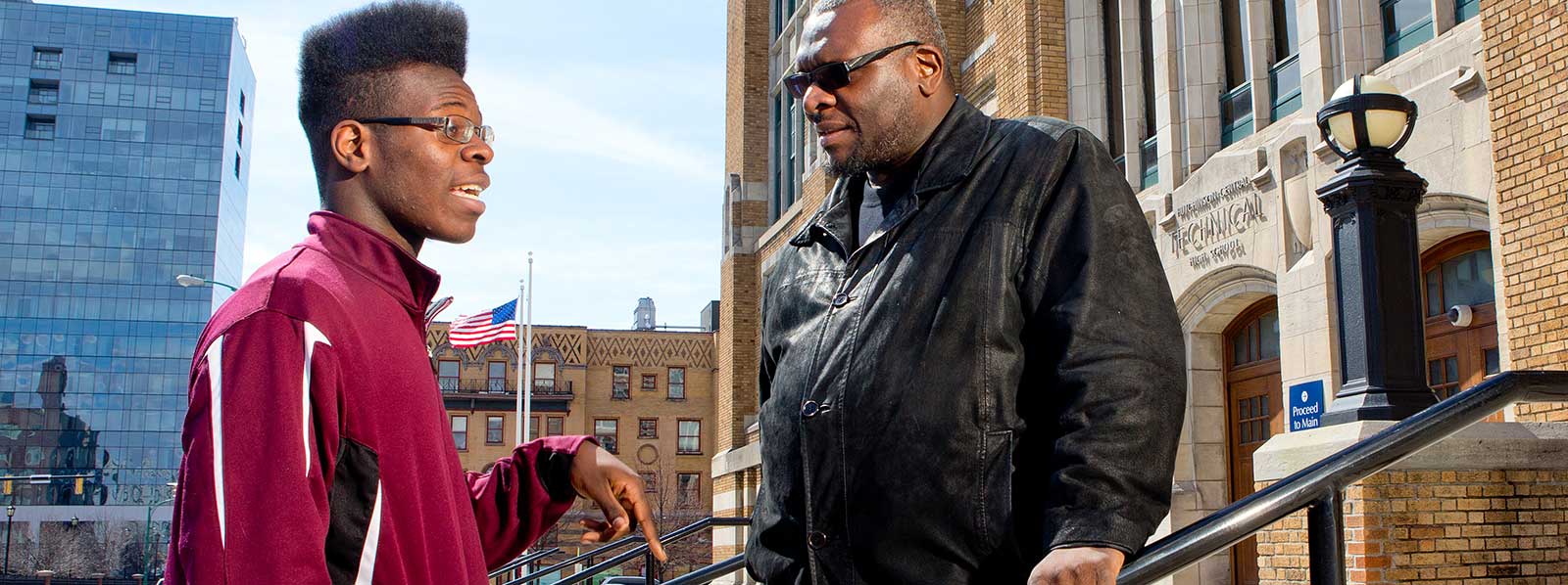 Sam Radford, president of the Buffalo Public Schools’ Parenting Coordinating Council, with his son, Aymanuel Radford. The elder Radford recalls the city’s less cooperative days. “Before,” he says, “it was everybody in their camp, everybody operating from their silo.”