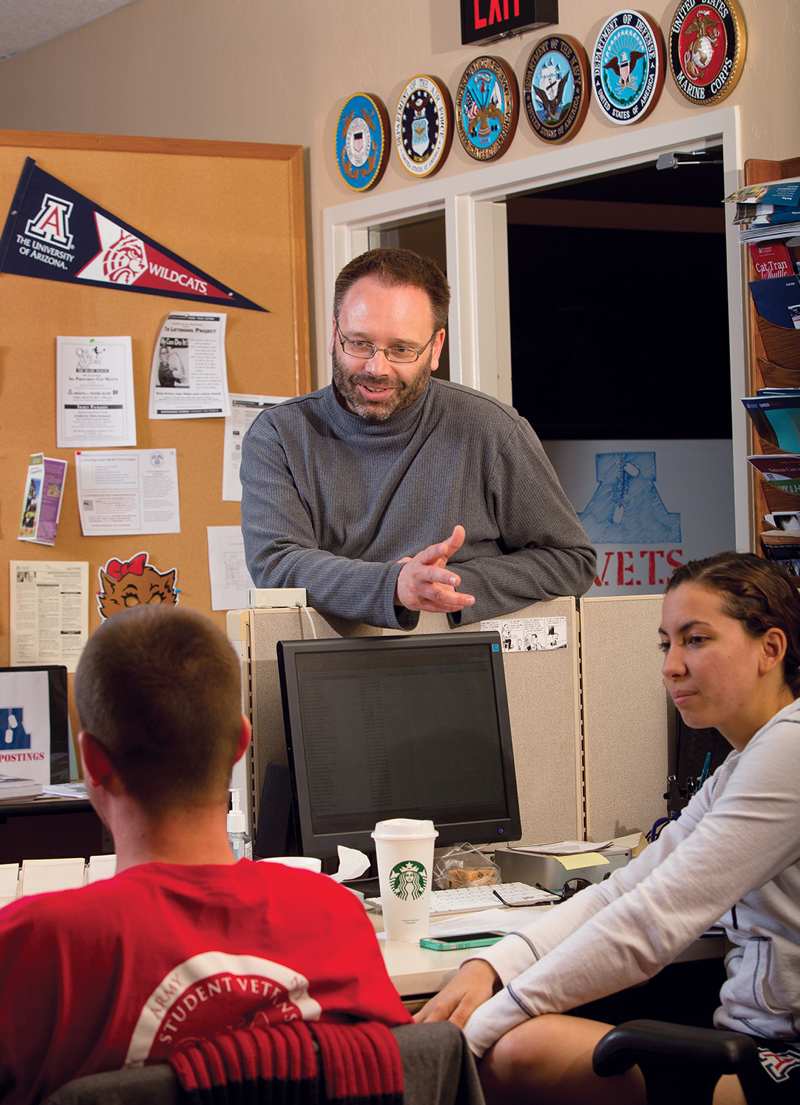 Bearded adult talks to younger students.