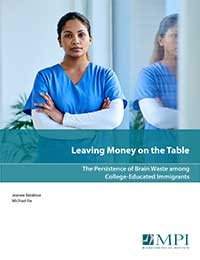 report cover image shows a young woman of color in scrubs with her arms folded.