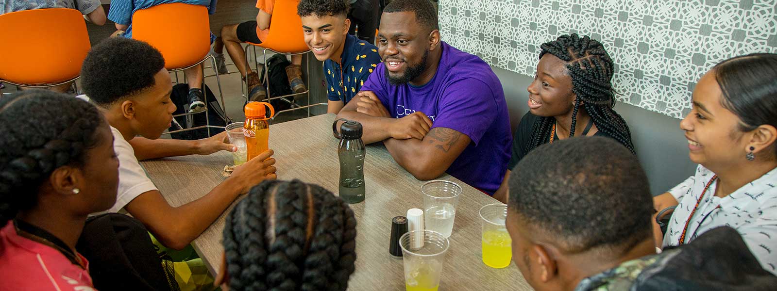 Clemson students sitting around a table.