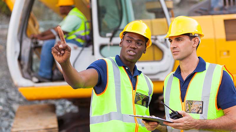 Road workers in safety gear.