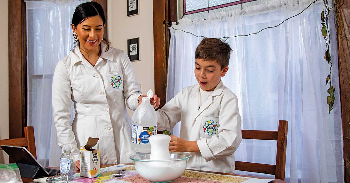 In their Minneapolis home, Antavia Paredes-Beaulieu and her 10-year-old son, Dakota Stevenson-Paredes, prepare an episode of their First Saturday Science program. The program, which is viewed online by more than 1,000 K-5 students and their families, is among Paredes-Beaulieu’s roles in her work-study program with Metropolitan State. 