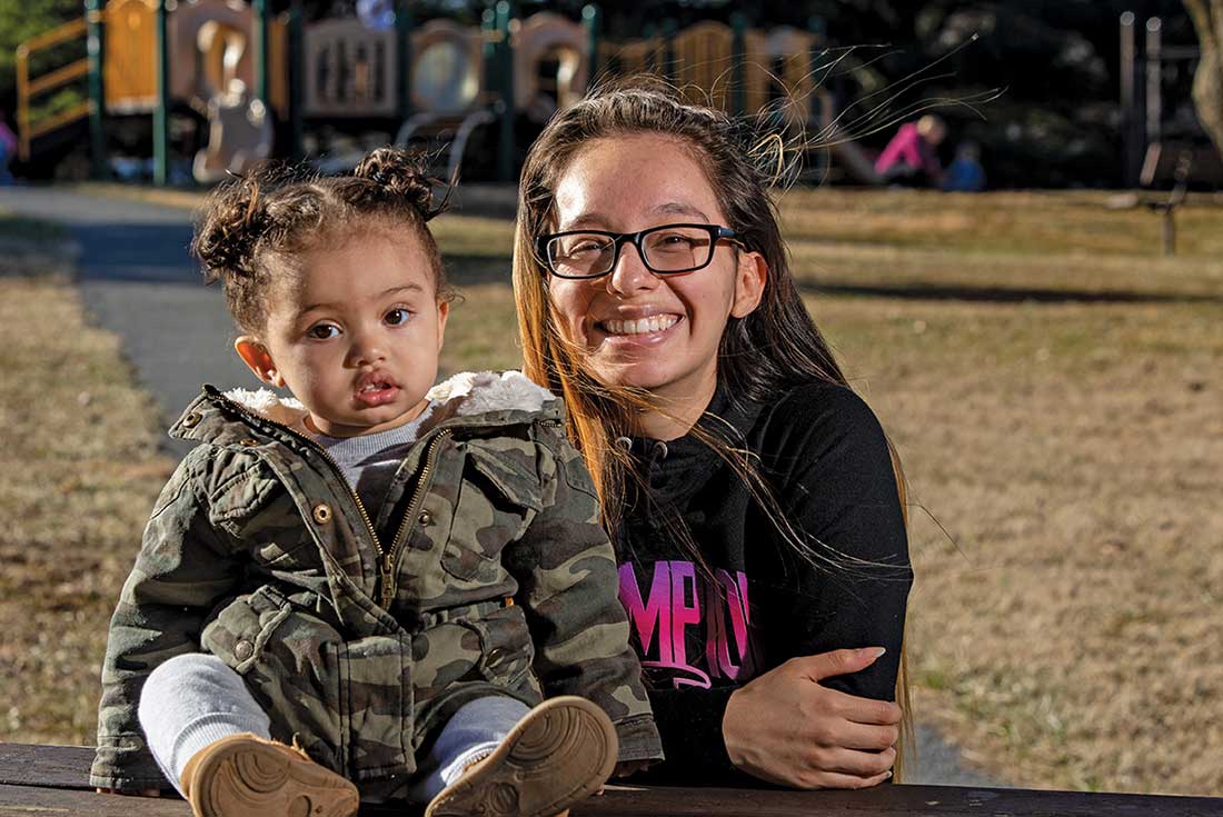 Josseline Cruz with her daughter at a park.