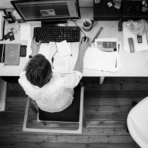 black and white overheat shot of student at computer. stock photo.