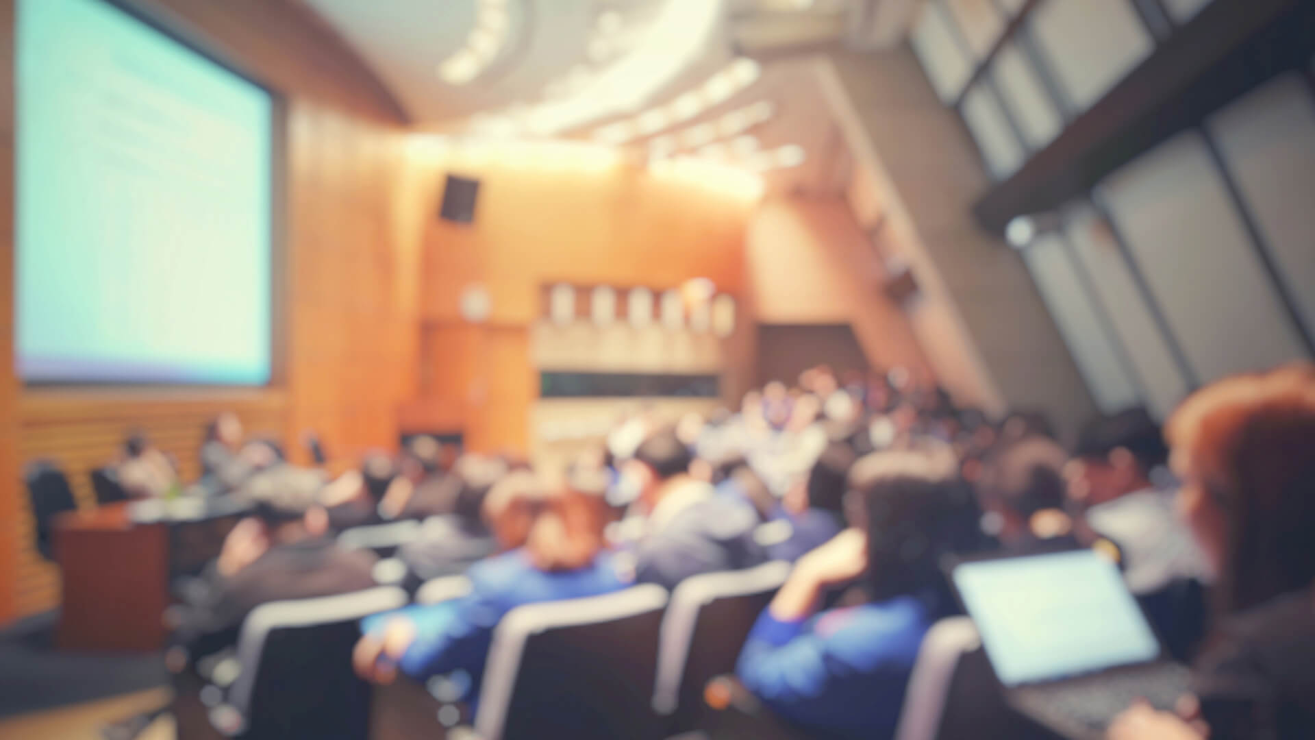 Large lecture hall with vaulted ceilings.