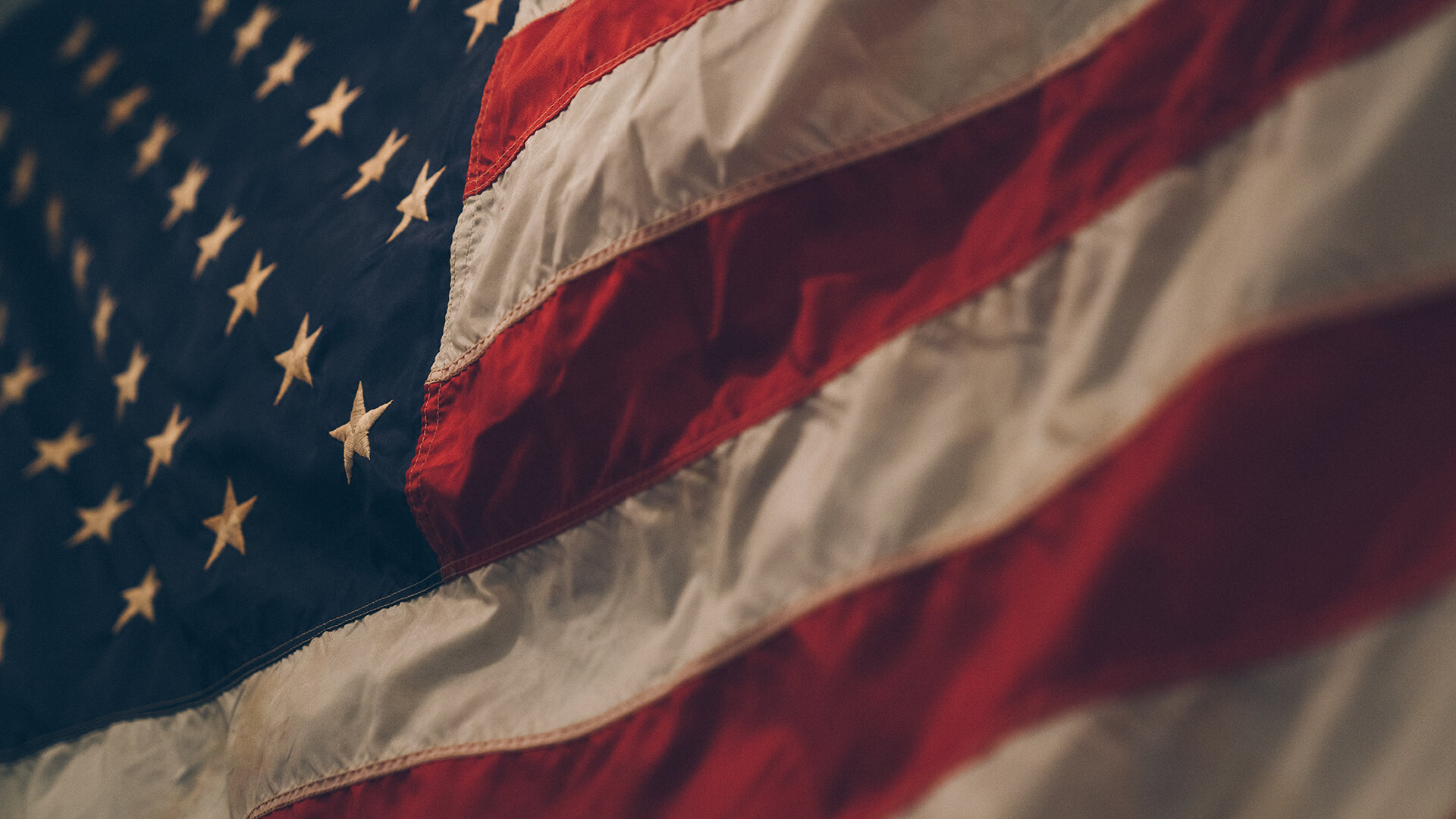 A closeup of the American flag doing its thang—it's waving.