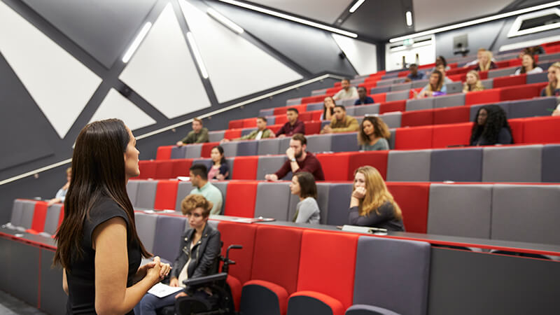 Woman teaching in a lecture hall.