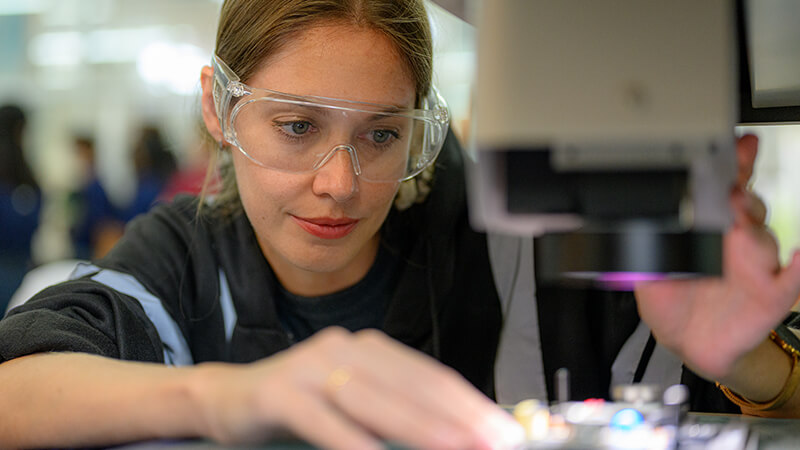 Professional technician checking and repairing part of automatic machine stock photo