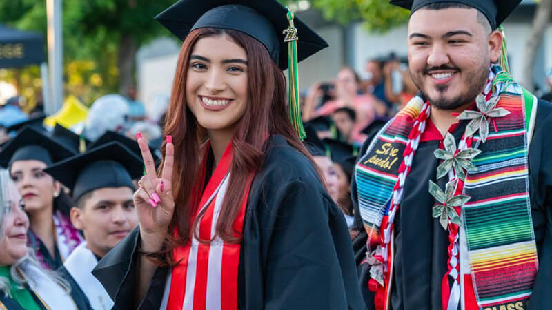 Karime Lopez celebrates after receiving her degree from Madera Community College at the school’s 2022 commencement.