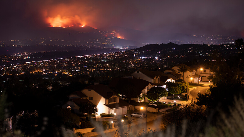 Smoke and flames of the Blue Ridge Fire engulf the hills above Yorba Linda, California.